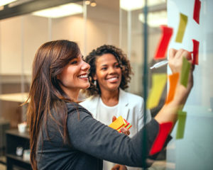 Marketing woman planing a guide for re-engagement campaigns email marketing