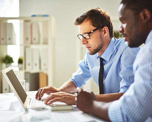 two business men going over examples of email database for better list segmentation